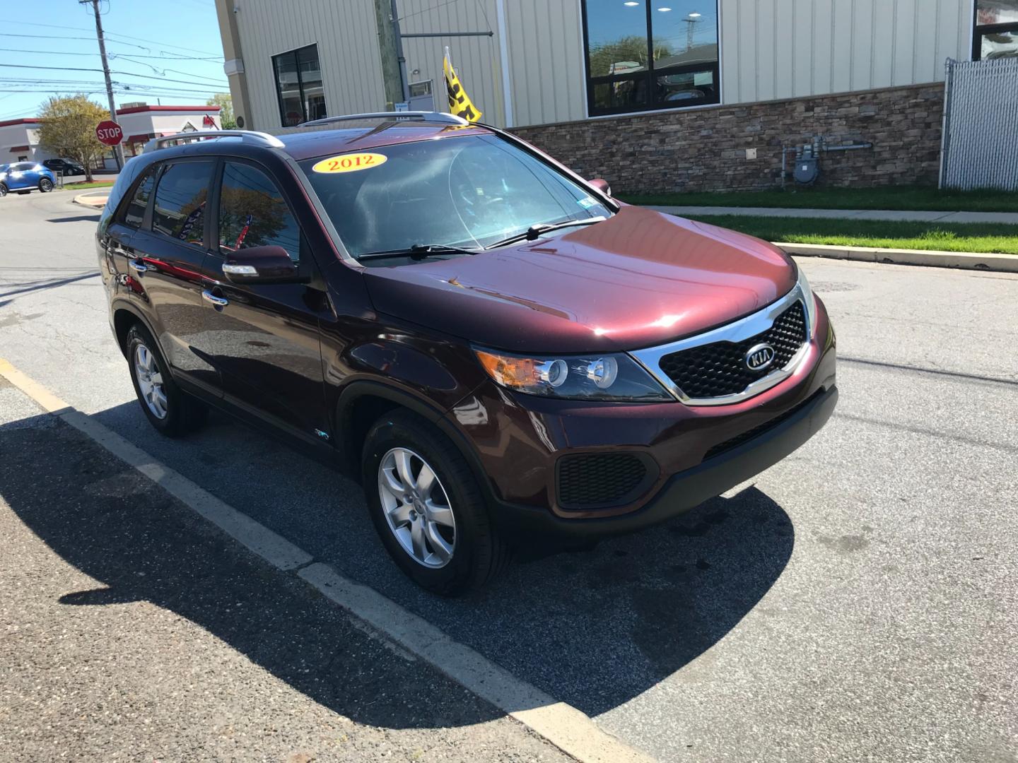 2012 Burgundy /Gray Kia Sorento LX (5XYKTDA29CG) with an 3.5 V6 engine, Automatic transmission, located at 577 Chester Pike, Prospect Park, PA, 19076, (610) 237-1015, 39.886154, -75.302338 - Photo#3